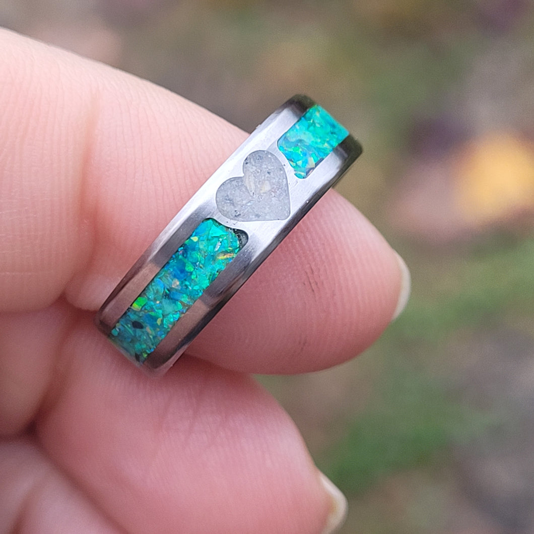 The heart shape center of this ring is created with cremains you send us. The color of opals seen here is green, but you can pick from 92 color options.