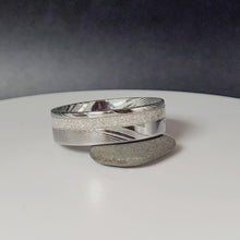 Load and play video in Gallery viewer, Damascus Steel Offset Memorial Ring

